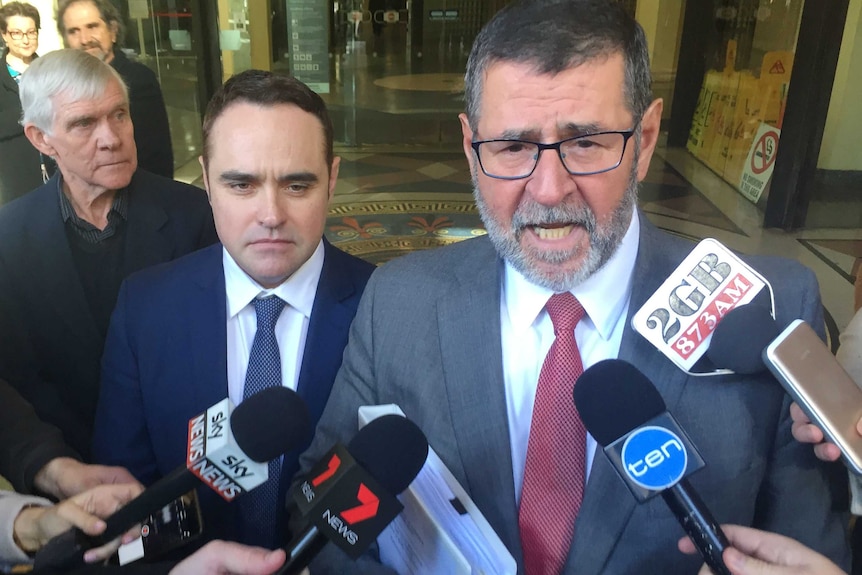 Ben McCormack (left) and his lawyer Sam Macedone outside Downing Centre Court in Sydney.