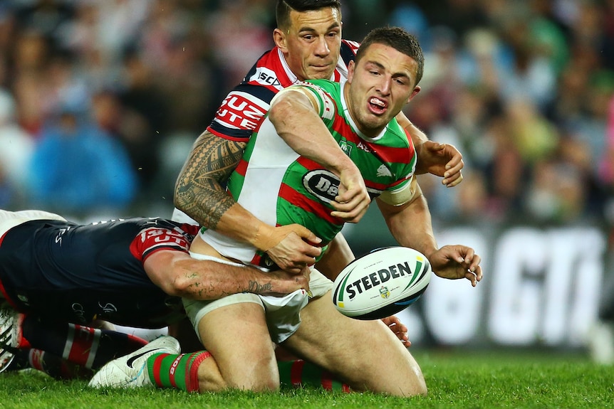 Sam Burgess drops a ball while tackled by Sonny Bill Williams