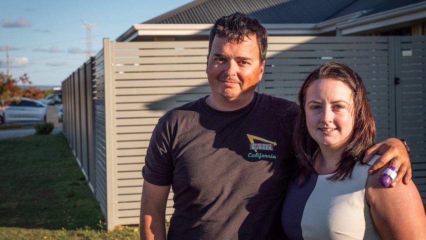 Denis Grzetic and Natasha Turfrey stand side by side outside their home in Harrisdale.