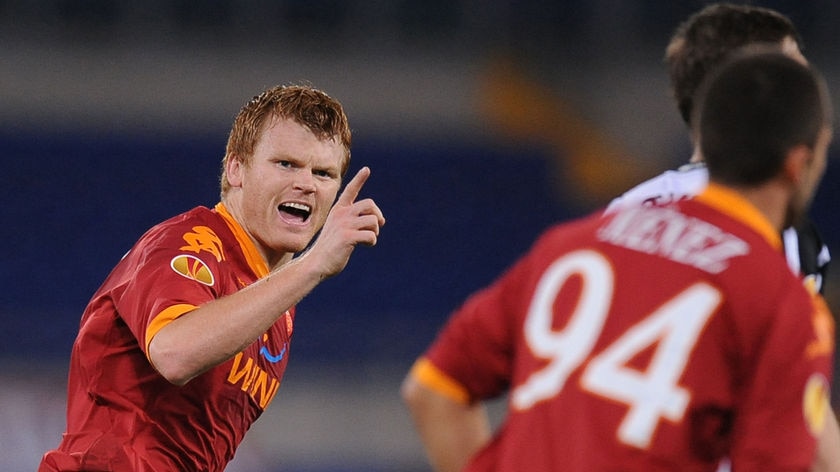 John Arne Riise celebrates after scoring against Fulham during AS Roma's group E Europa Cup match