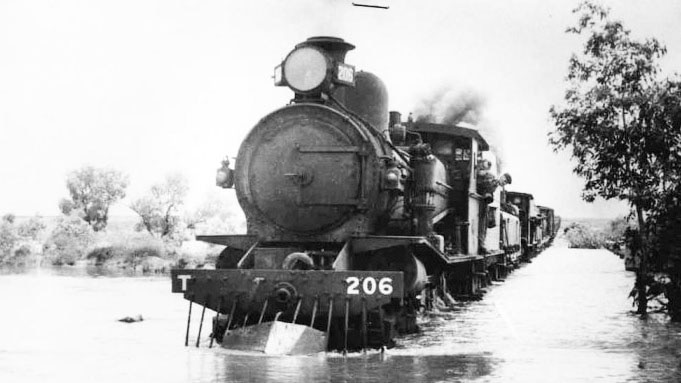 Ghan on flooded rail line in the outback