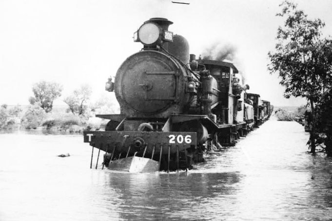 Ghan on flooded rail line in the outback