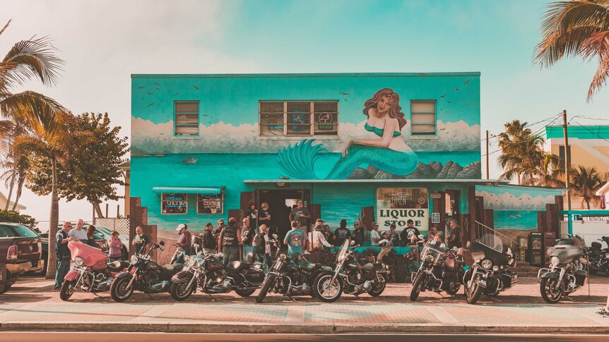 A large group of bikies parked outside a liquor store in Fort Myers, USA