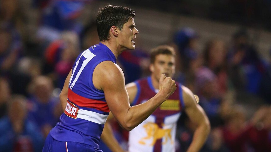 On target ... Tom Boyd celebrates after kicking a goal for the Bulldogs