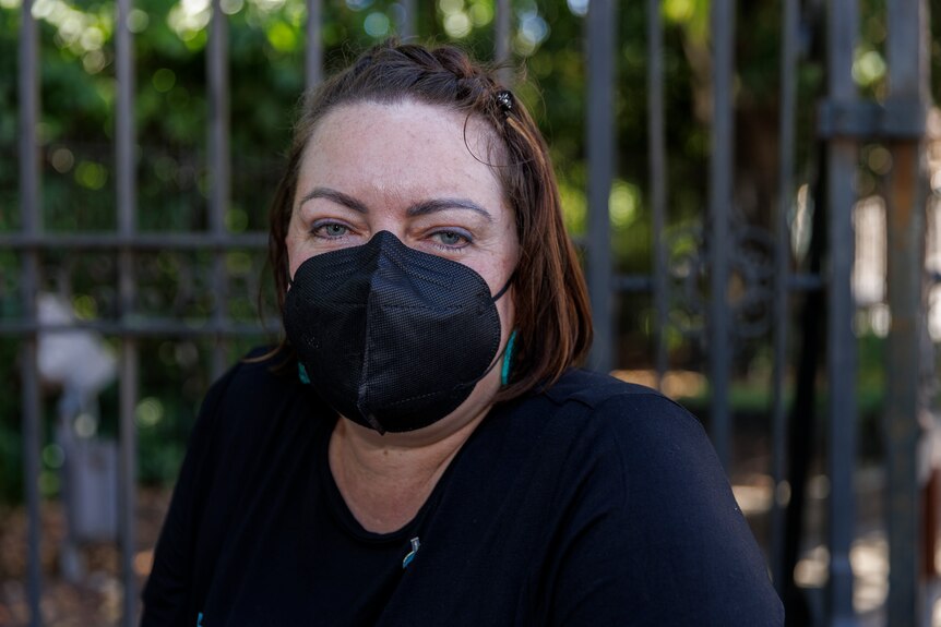 Alicia Newnham wearing a black facemask. 