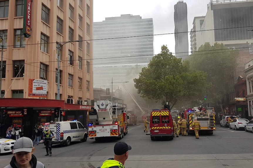 Smoke can be seen coming from the roof a restaurant near the corner of Bourke and Russell streets in Melbourne's CBD.
