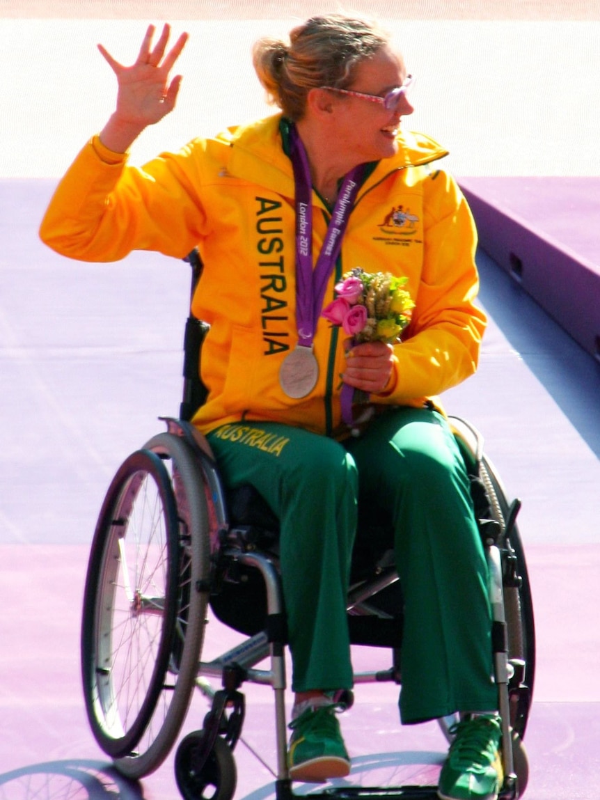 Paralympic athlete Louise Ellery with her silver medal for shot put in London.