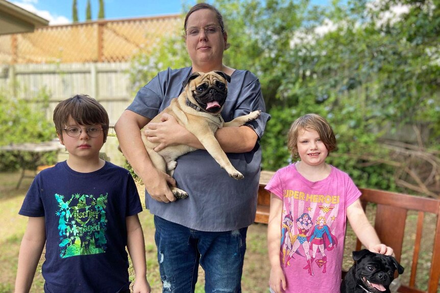 Mum Cassie Windsor with her son Zeike and daughter Mysan, and their two dogs.