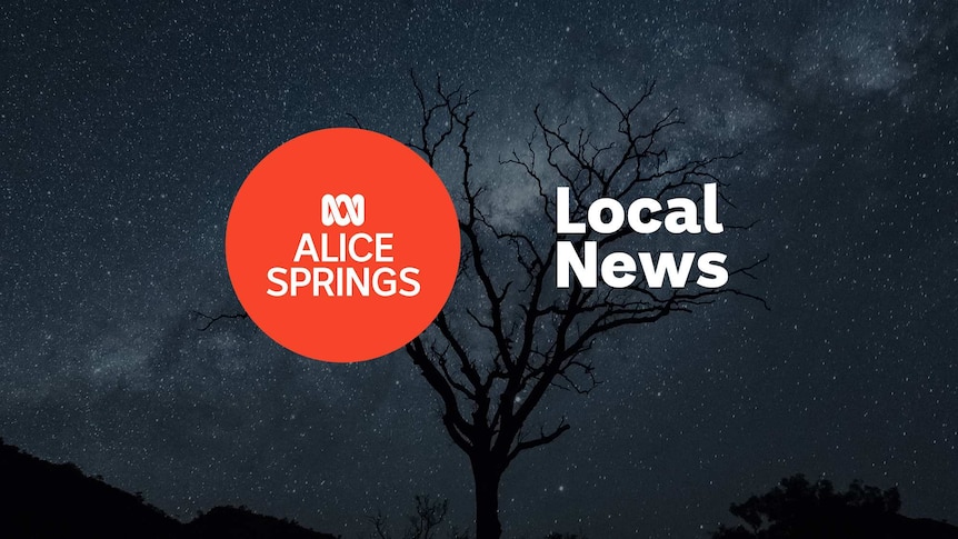 The Milky Way seen through a dead tree's branches; ABC Alice Springs logo and Local News superimposed.