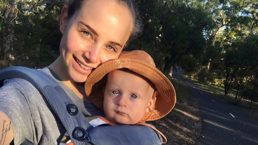 Laura Hills with her baby Ziggy in a park to depict structuring your week when at home with a baby or toddler during coronavirus