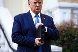 Donald Trump holding a bible