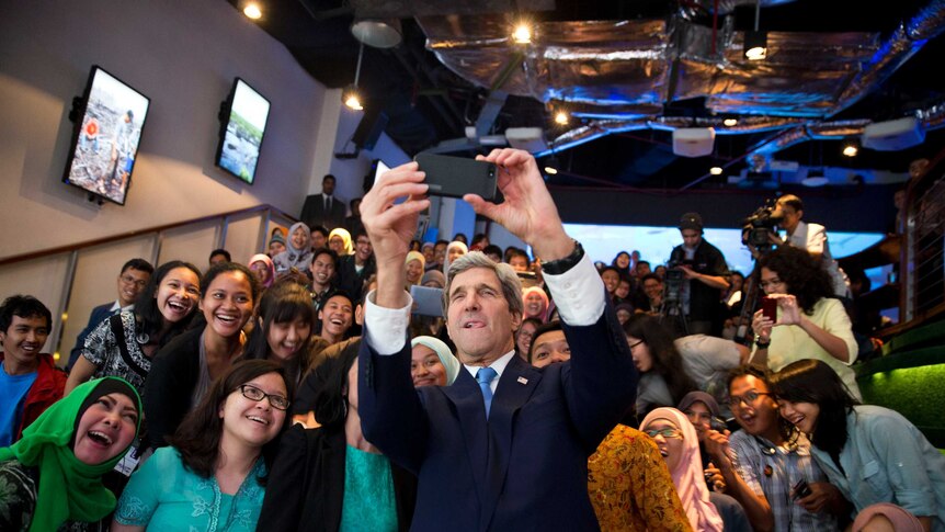 John Kerry with group students in Jakarta