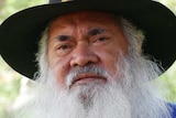 Senator Dodson stands next to a tree near the Broome court house.