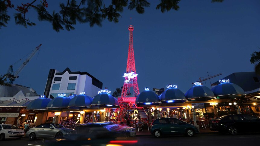 A replica of the Eiffel Tower sits above cafes in the Brisbane suburb of Milton.