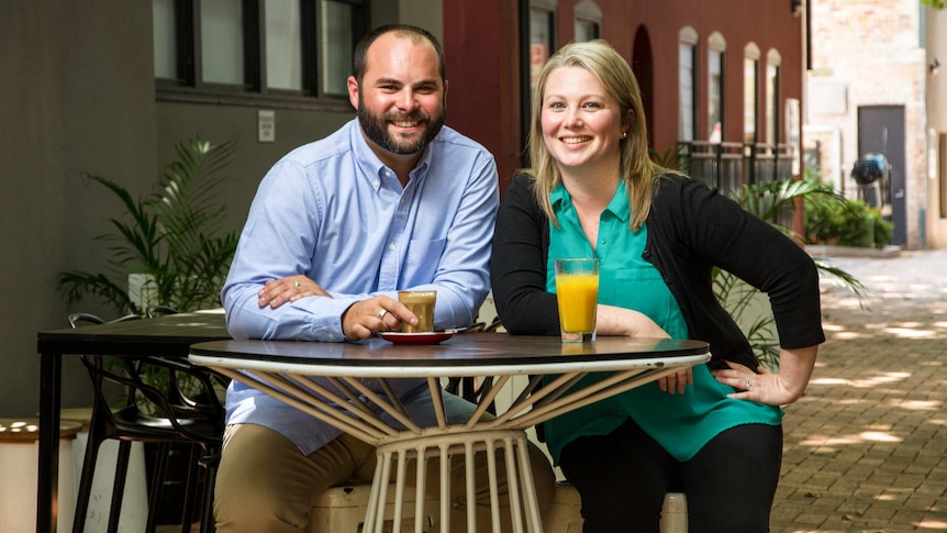 Dan Cox and Jenny Marchant sitting at a cafe table.