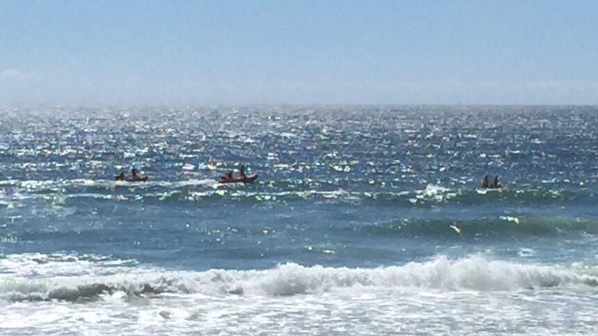 Search for man missing in surf