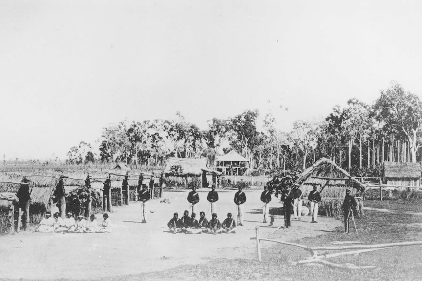 White officers and Aboriginal troopers and their wives at the Lower Herbert NMP camp in north Queensland.