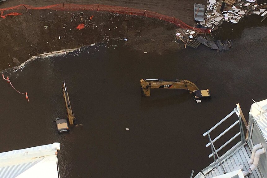 Excavators submerged at Myer site in Hobart