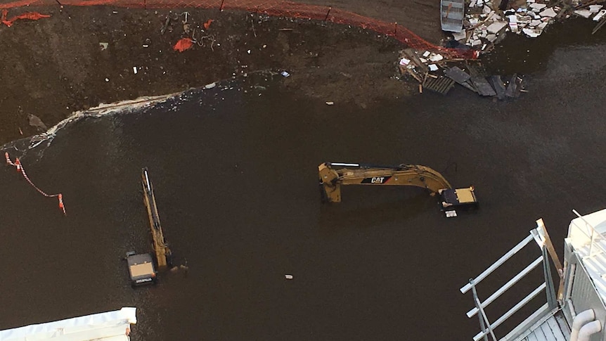 Excavators submerged at Myer site in Hobart