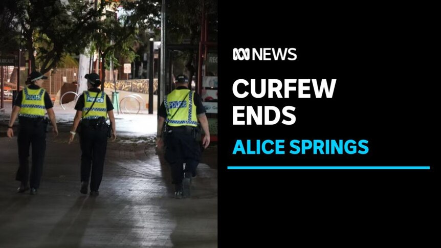 Curfew Ends, Alice Springs: Three police patrol a street at night.