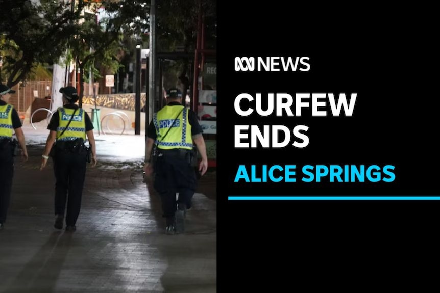 Curfew Ends, Alice Springs: Three police patrol a street at night.