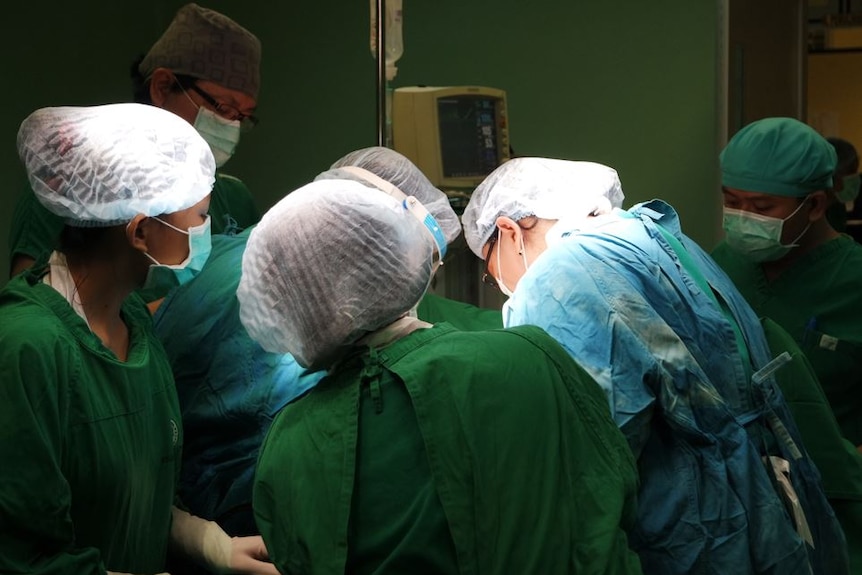 Surgical crew in operating theatre inTimika hospital