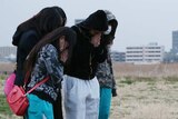 Japanese school children pray for their murdered friend Ryota Uemura