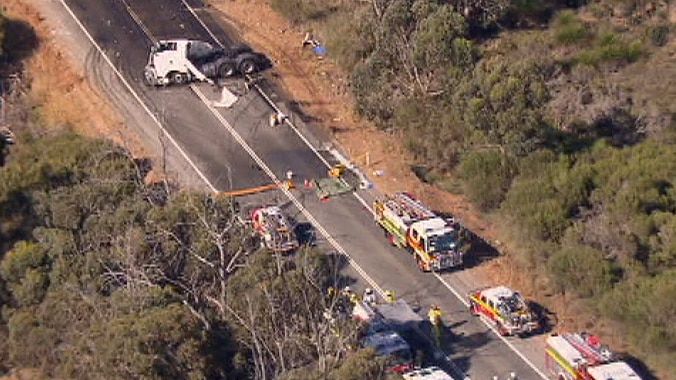 Emergency vehicles gather at scene of fatal crash on Great Eastern Highway at Beechina, east of Perth