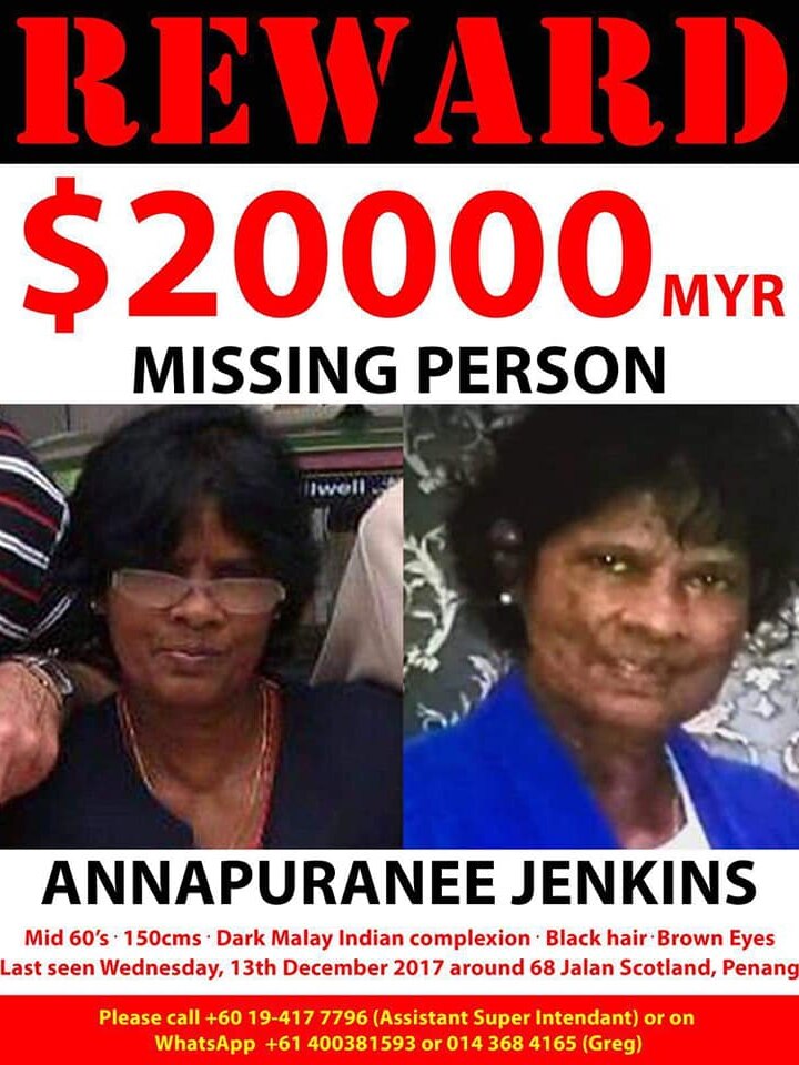A poster saying REWARD $20000 and two pictures of a woman