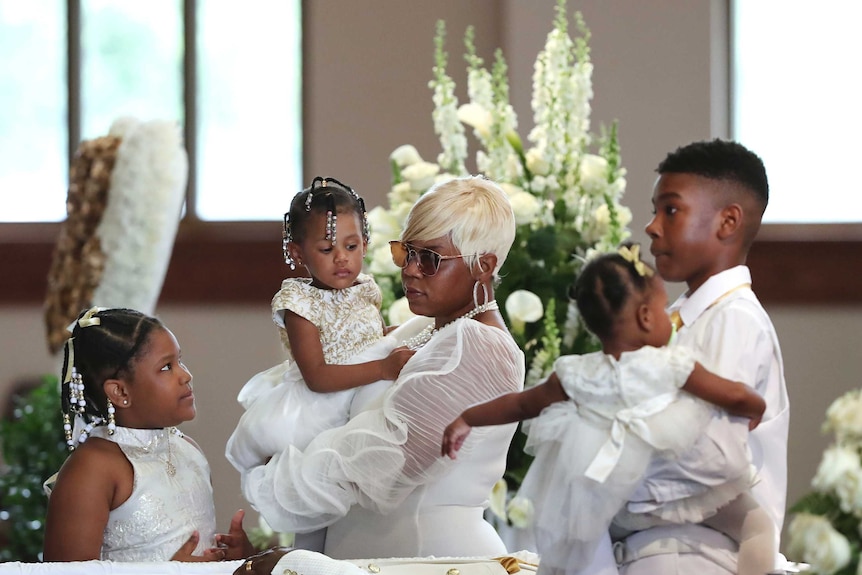 The family of Rayshard brooks, all dressed in white at his funeral.