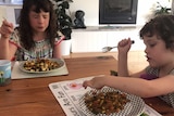 Madeleine Morris' daughters Scarlett and Nine try tofu.