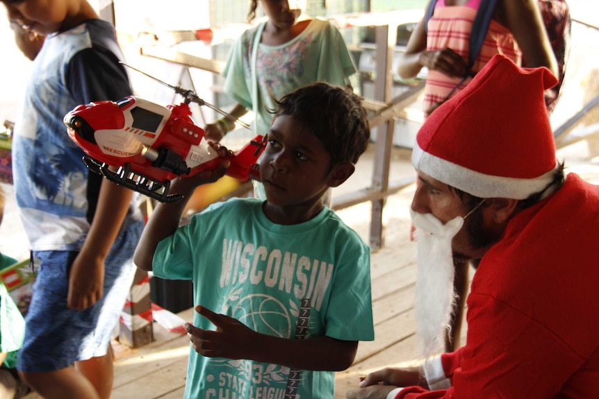 A boy from Urandangi receives a Christmas present