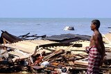 A man surveys the damage along the coast in the southern Sri Lankan town of Lunawa