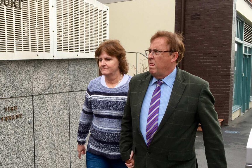 Stuart Slade and his wife enter Hobart Magistrates Court