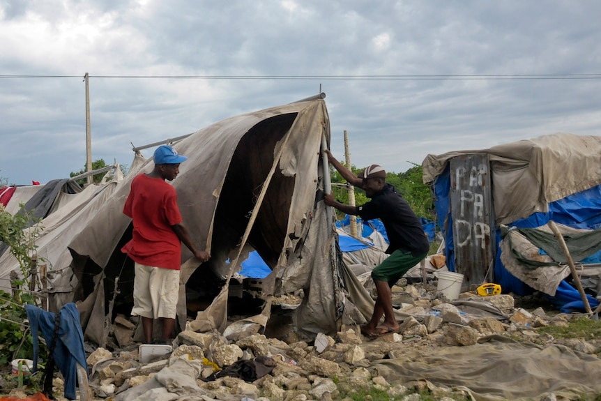 Haitians clean up following Tropical Storm Isaac