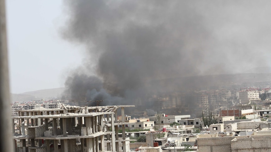 Smoking buildings in Daraya, Syria