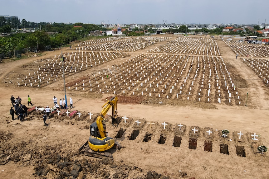 An aerial view showing lines of gravestones for COVID-19 victims in Jakarta, on August 4, 2021.