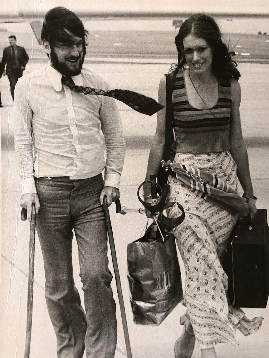Black and white photo of couple after disembarking plane in 1972.