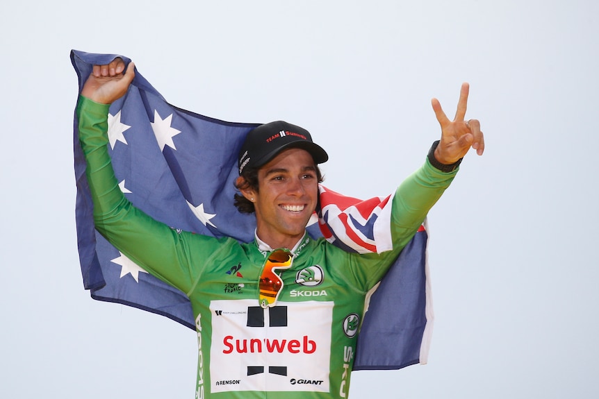 Michael Matthews dons the green jersey and celebrates with Australian flag at Tour de France