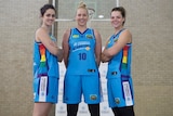 Canberra Capitals players show off their rainbow jerseys