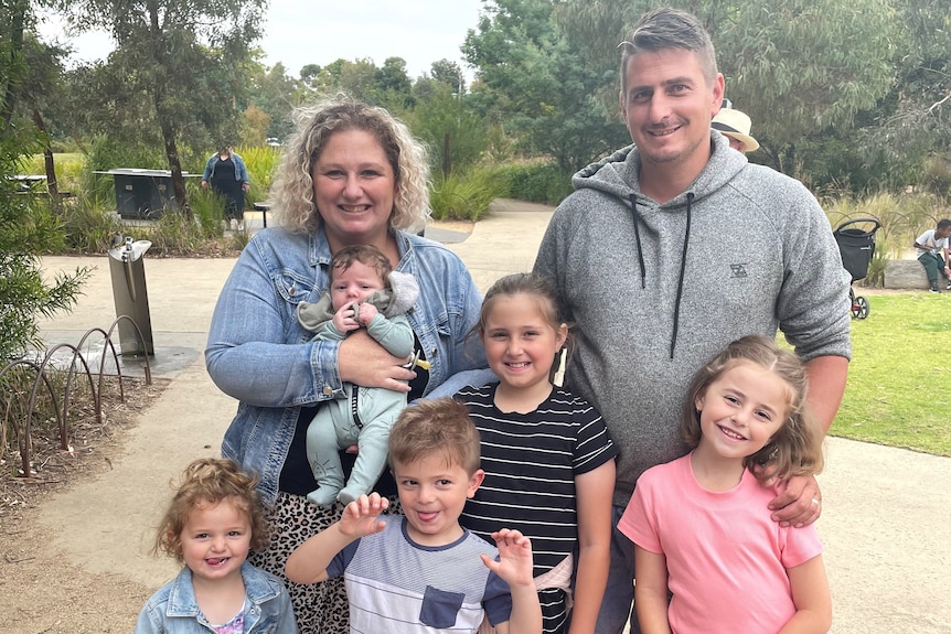 Melanie Velden and her family smile while in Victoria.