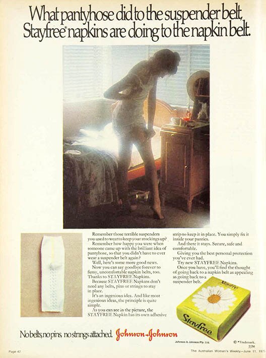 Magazine ad with image of woman in white slip adjusting her stockings