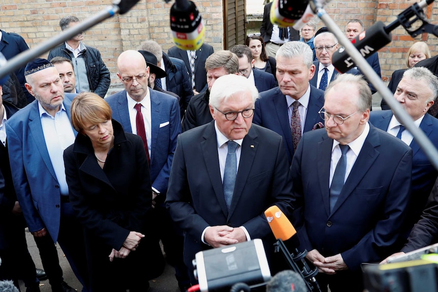 German President Frank-Walter Steinmeier stranding in front of media next to his wife Elke Budenbender and Saxony-Anhalt.