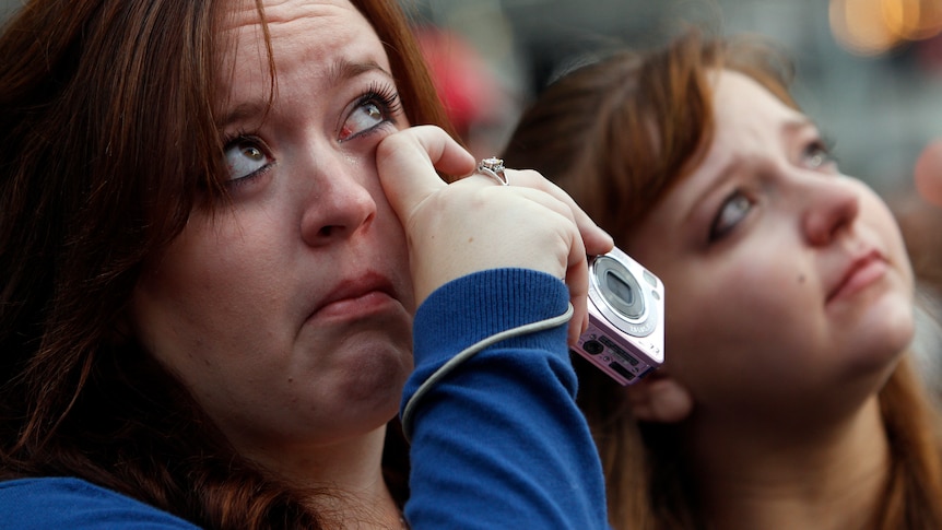 Woman cries during September 11 memorial