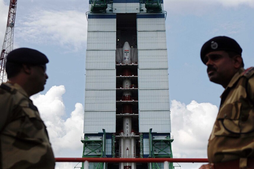 Security personnel guard rocket bound for Mars