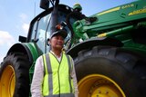 Myanmar refugee Nay Ku standing in front of a tractor at the Muresk Institute 2020.