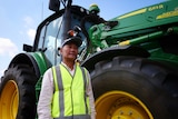 Myanmar refugee Nay Ku standing in front of a tractor at the Muresk Institute 2020.
