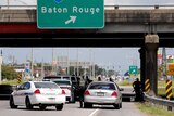 Police officers block off a road after a shooting of police in Baton Rouge.