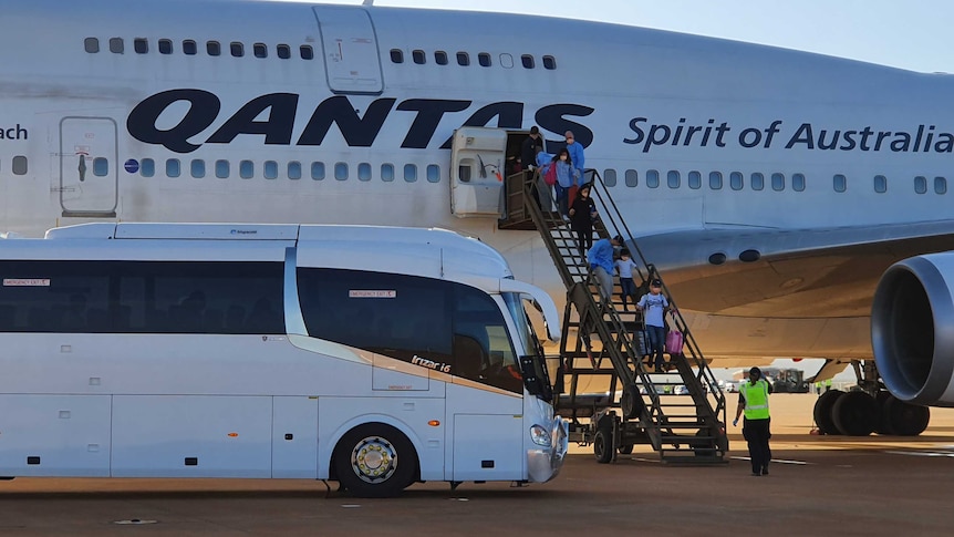 Evacuated Australians arrive at the RAAF base Learmonth.