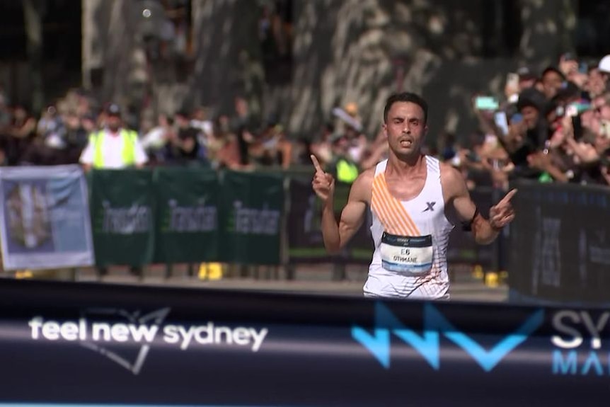 Record turn out for Sydney marathon as Moroccan winner reflects on devastation at home